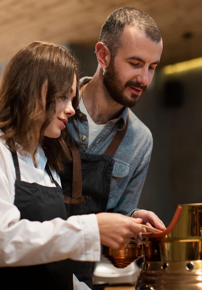 couple-working-coffee-machine